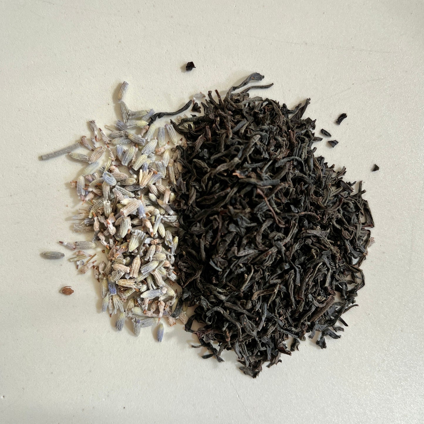 Photo of Uproot Teas' colorado-grown organic lavender next to sri lankan single origin earl grey tea- black tea infused with bergamot